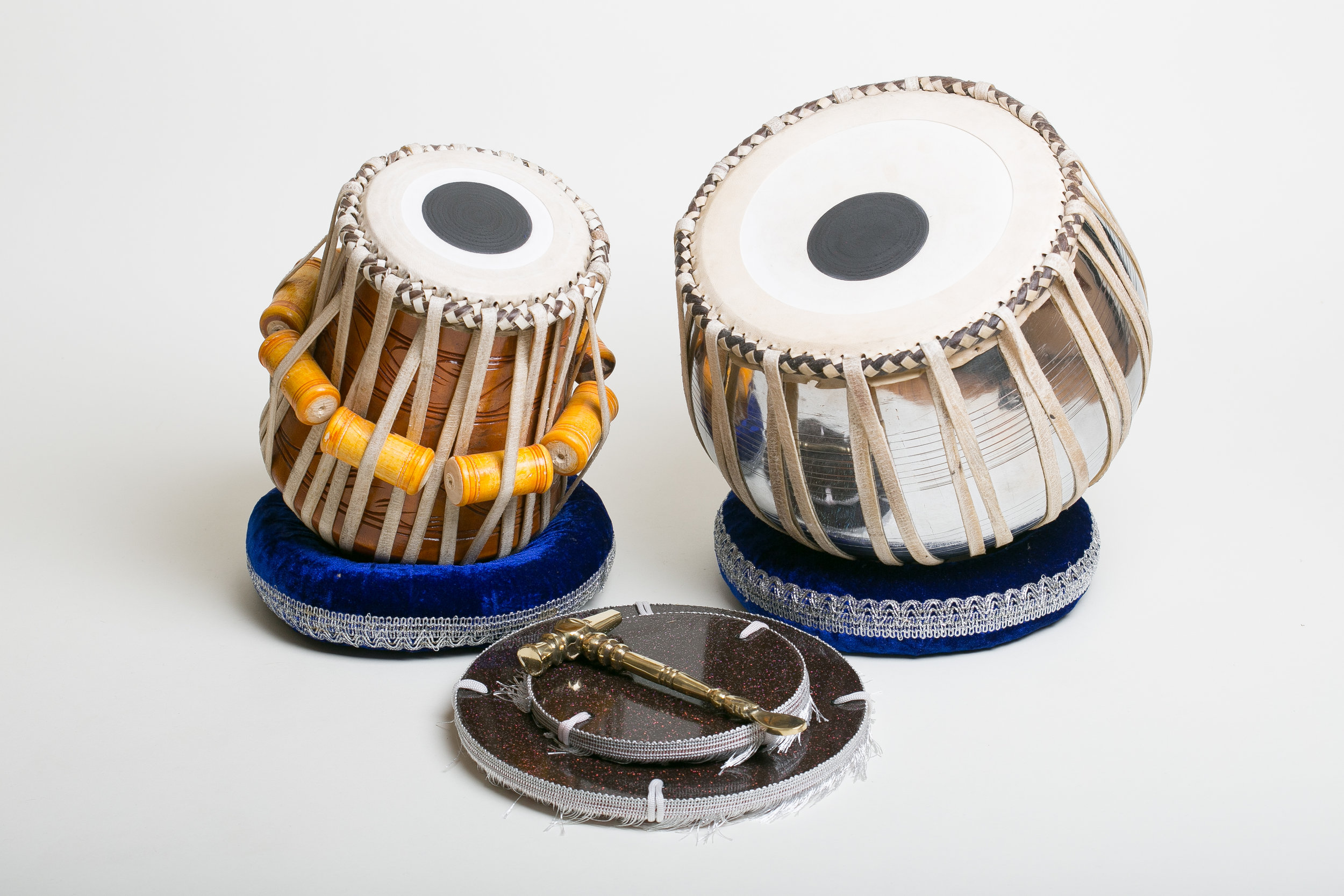 A complete professional tabla set with dayan and copper bayan